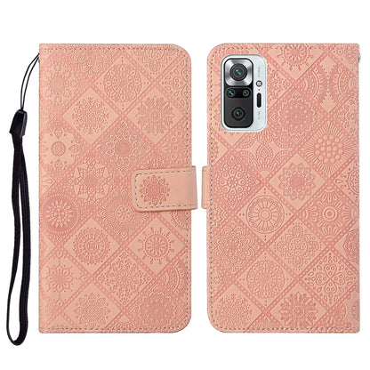 Pink embossed flip leather phone wallet case with card slots and wrist lanyard.