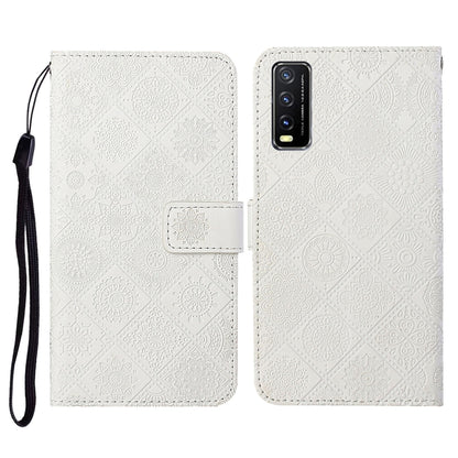 White embossed leather folio phone case with card slots and wrist lanyard