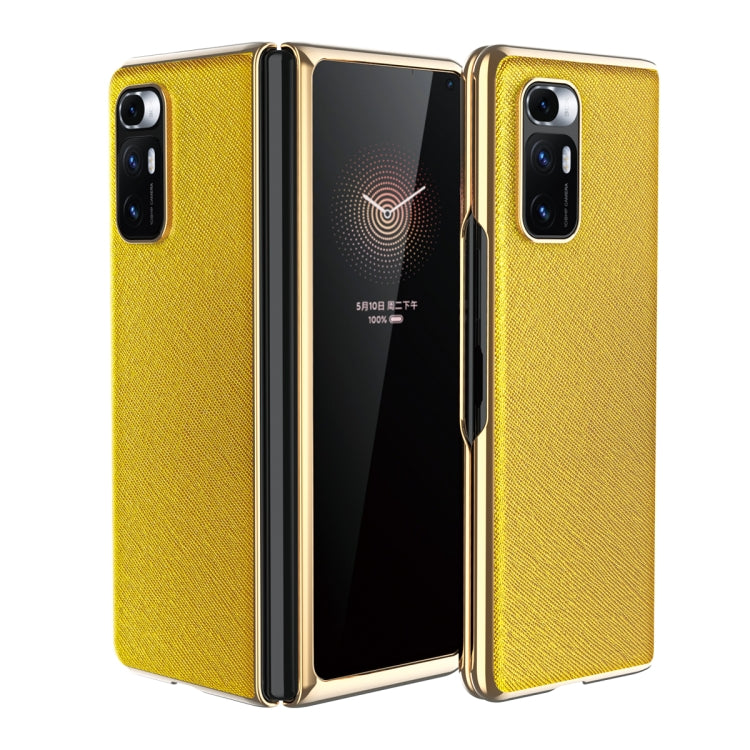 Yellow leather-texture protective phone case with gold-tone edges and dual rear cameras