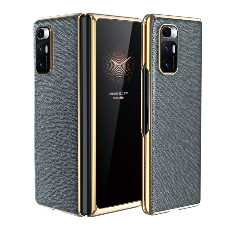 Light gray leather-texture protective phone case with gold-tone edges and dual rear cameras