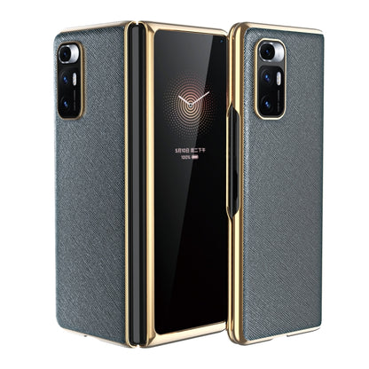 Light gray leather-texture protective phone case with gold-tone edges and dual rear cameras