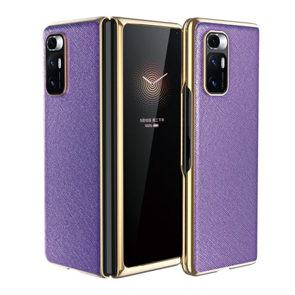 Purple leather-texture protective phone case with gold-tone edges and dual rear cameras