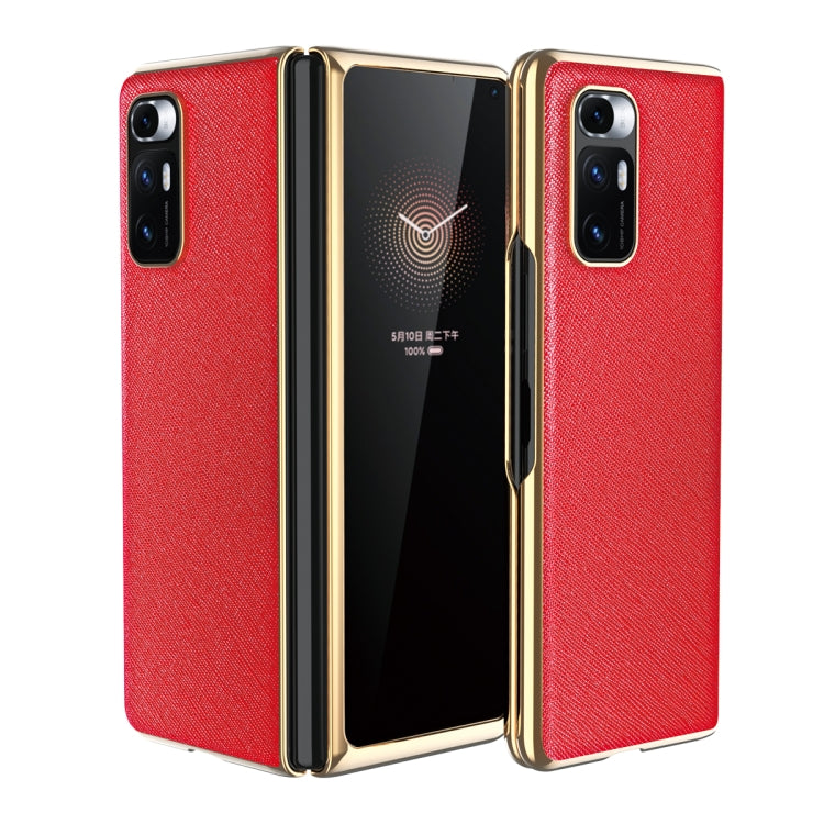 Red leather-texture protective phone case with gold-tone edges and dual rear cameras