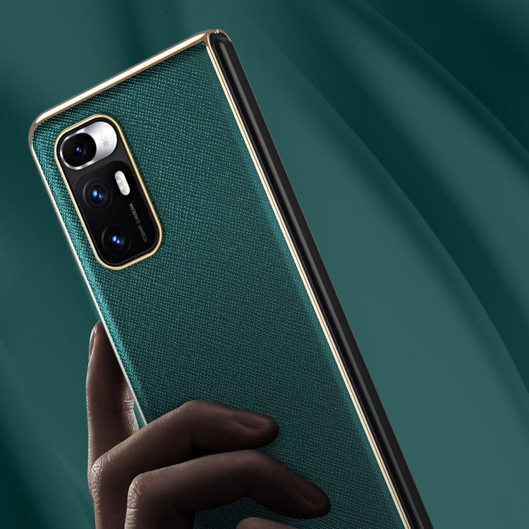 Dark green textured leather-style protective phone case with camera cutouts and raised edges