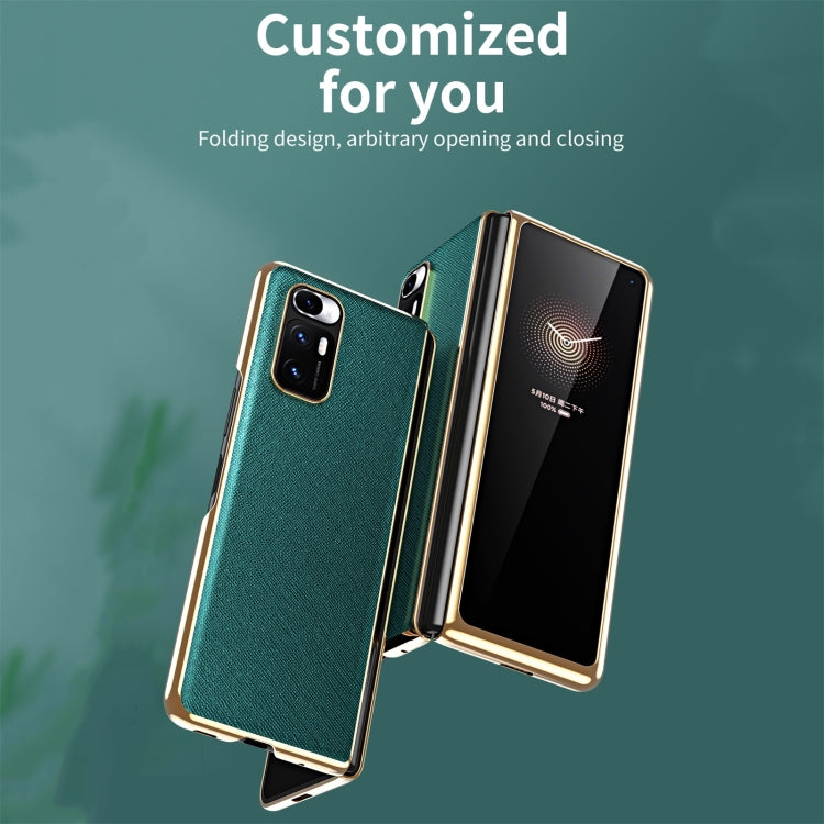 Folding dark green leather-style case with metal frame, front cover open and camera cutout