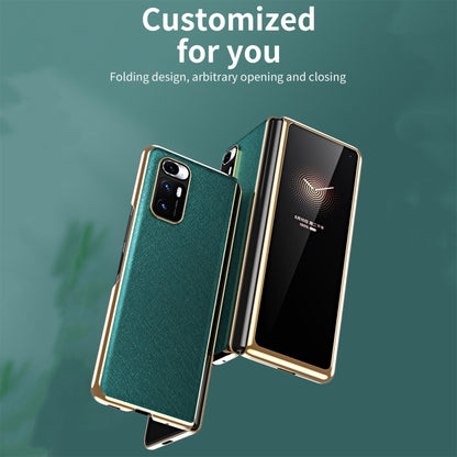 Folding dark green leather-style case with metal frame, front cover open and camera cutout