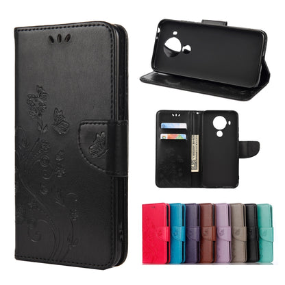 Black leather flip phone case with butterfly floral pattern, holder and card slots