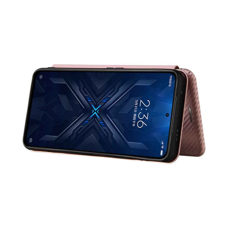 Pink magnetic flip phone case with carbon fiber texture, horizontal closed view