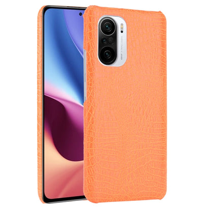 Orange crocodile-texture phone case with dual-camera cutout and buttons openings