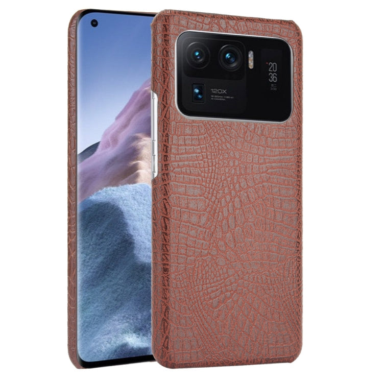 Cognac brown crocodile-texture phone case with dual-camera cutout