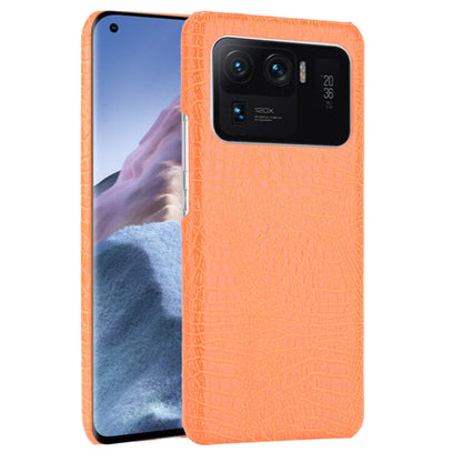 Bright orange crocodile-texture phone case with camera cutout and lens openings