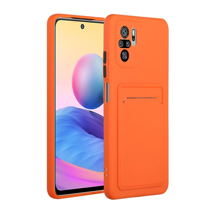 Shockproof TPU phone case with card slot, orange with raised camera protection.