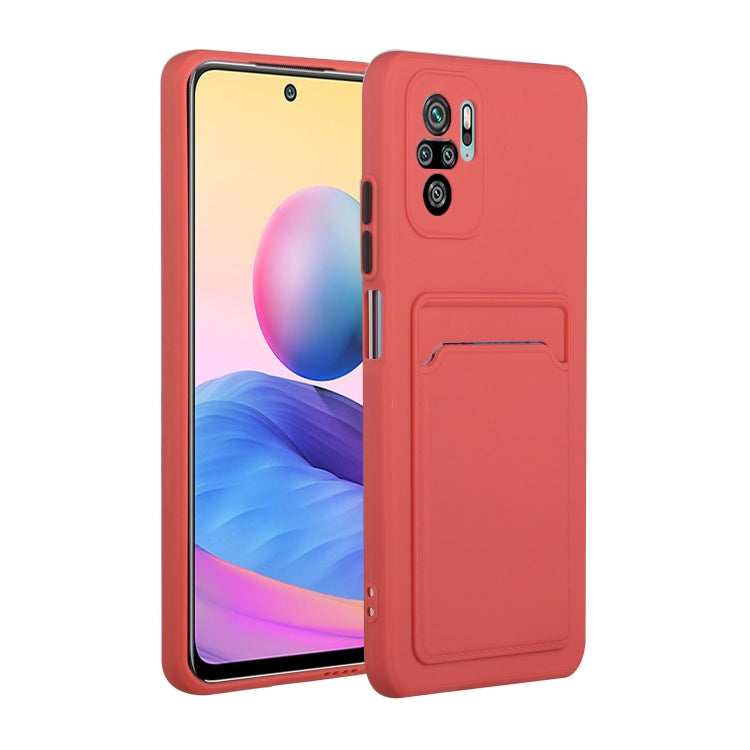 Shockproof TPU phone case with card slot, coral-red with raised camera protection.