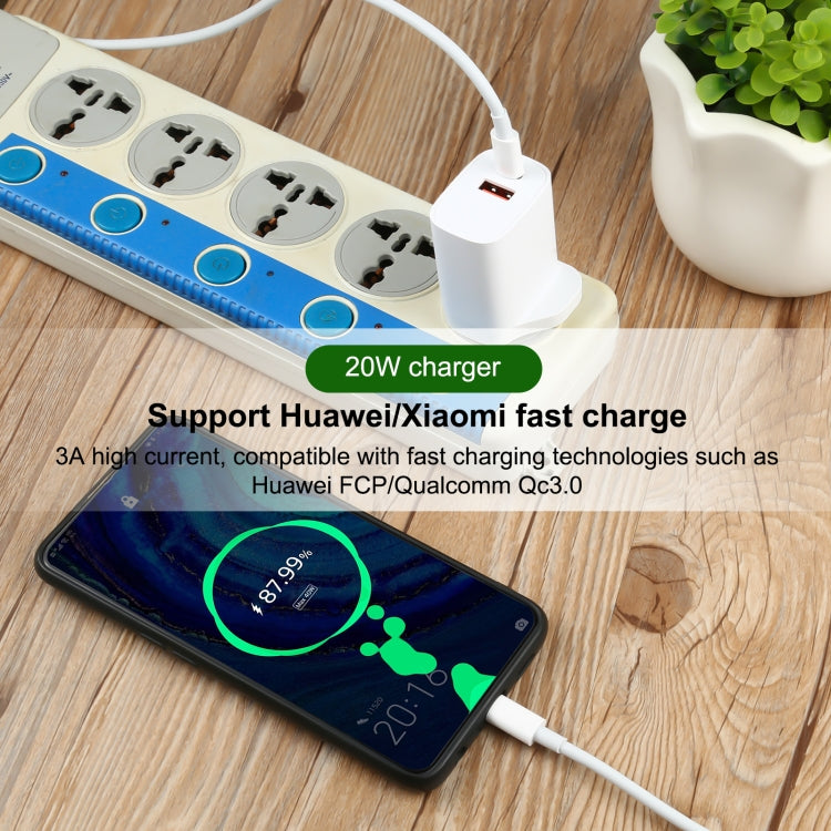 White charger and USB-C cable powering a smartphone connected to a multi-outlet strip