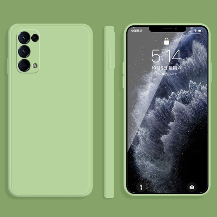 Light green liquid silicone phone case with raised edges and camera cutouts