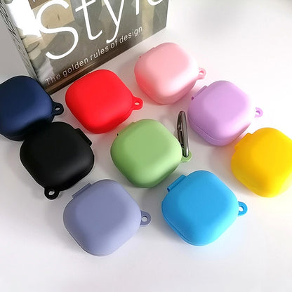 Assorted-color silicone protective earbud cases with hooks, including black, red, purple, and blue.