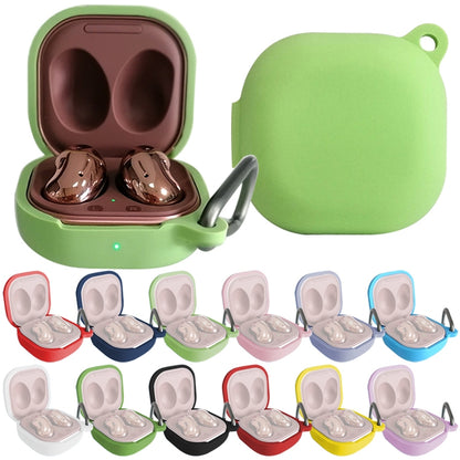 Silicone Bluetooth earphone protective case with hook, green, open to show earbuds inside