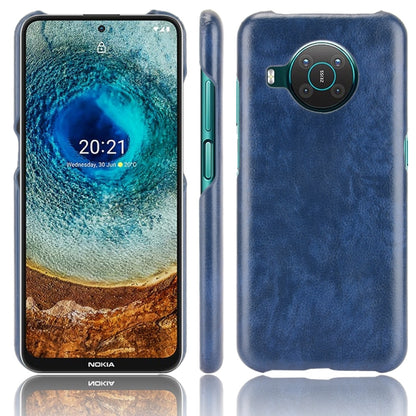 Shockproof phone case with litchi texture, blue dual-layer PC/PU, rear camera cutout