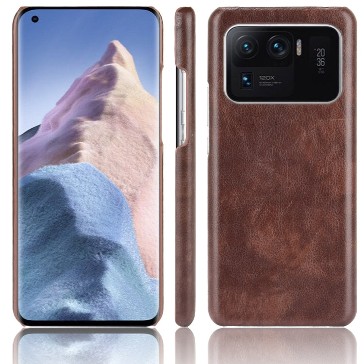 Shockproof phone case with litchi texture, brown dual-layer PC/PU, rear camera cutout
