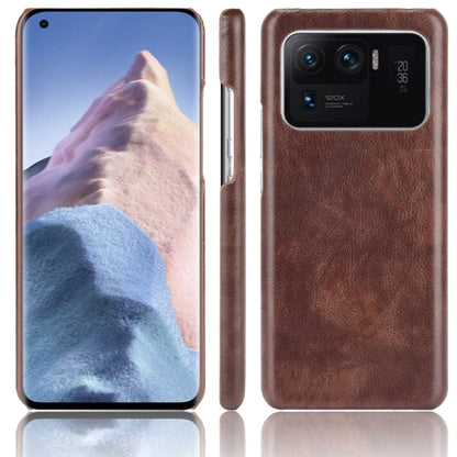 Shockproof phone case with litchi texture, brown dual-layer PC/PU, rear camera cutout