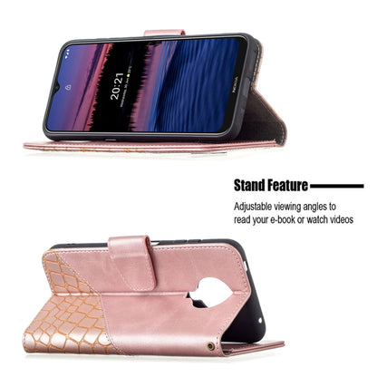 Rose gold crocodile-texture wallet case with stand feature for viewing phone screen.
