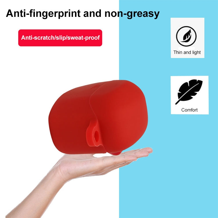 Red silicone earbud protective case with hook, held in hand for grip