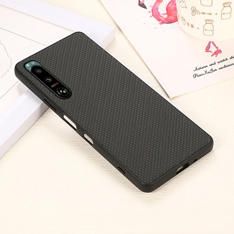 Slim protective phone case with carbon-fiber texture, black, side button and port openings