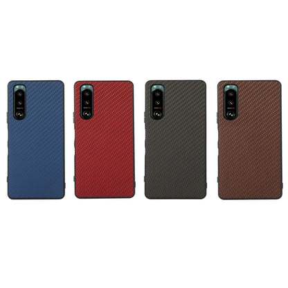 Protective phone cases set in blue, red, dark gray, and brown with carbon-fiber texture