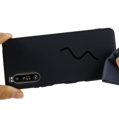 Black silicone phone case showing camera module and textured grip edge