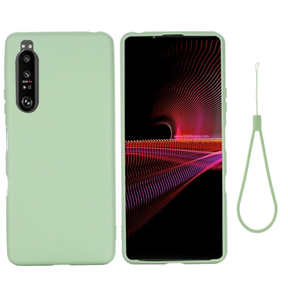 Light green liquid silicone shockproof phone case with camera cutout and lanyard