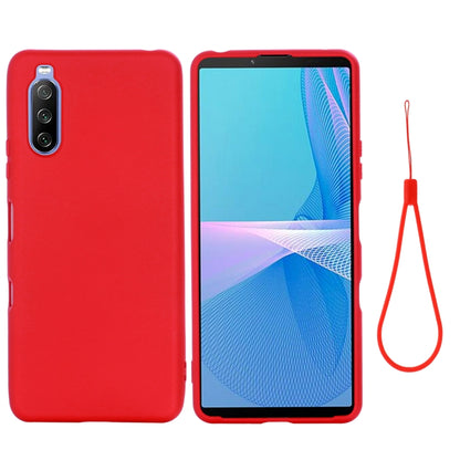 Red silicone phone case with camera protection and matching lanyard