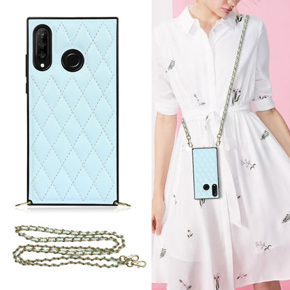 Light blue quilted diamond phone case with crossbody chain strap and wide camera opening