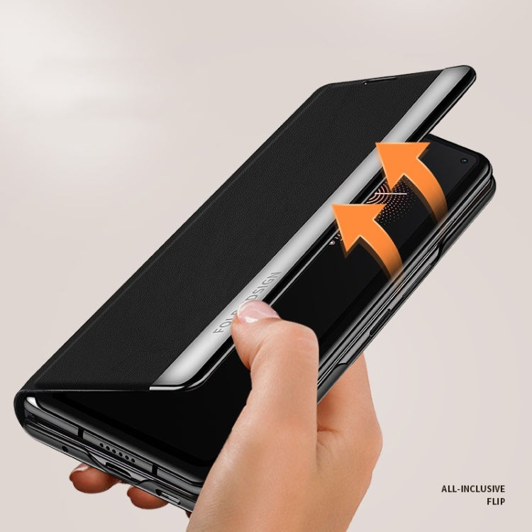 Matte black folding leather case for a foldable smartphone, hand folding the protective cover