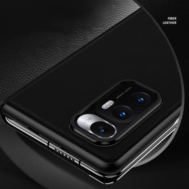 Matte black cowhide-style leather case with textured finish and camera cutout