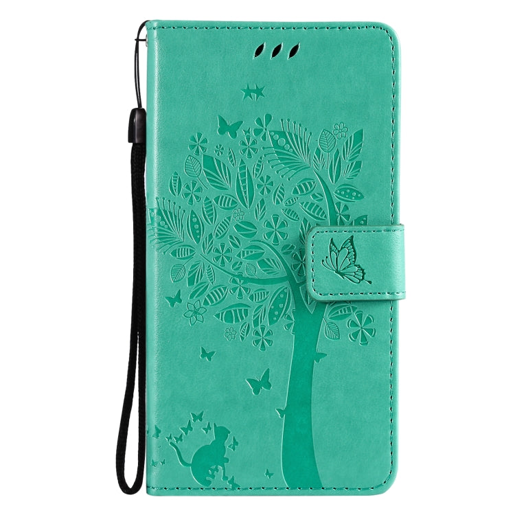 Green PU leather flip phone case with tree, butterfly, and cat pattern; lanyard strap
