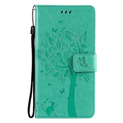 Green PU leather flip phone case with tree, butterfly, and cat pattern; lanyard strap