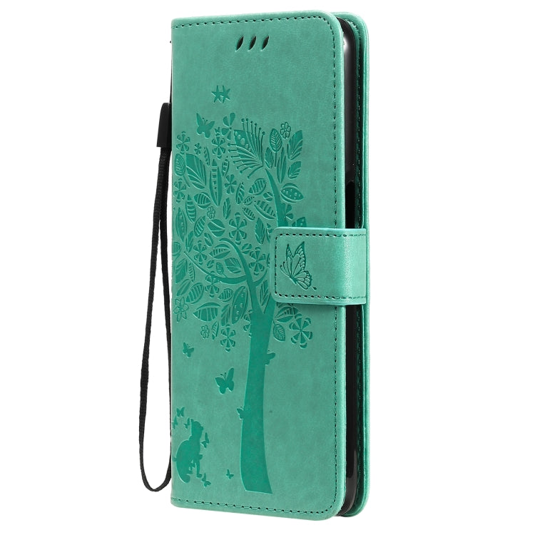Green PU leather flip phone case with tree & cat pattern, side view with strap
