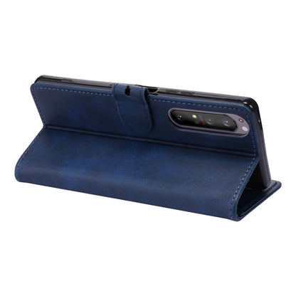 Blue leather flip phone case with magnetic flap and embossed cat face on back