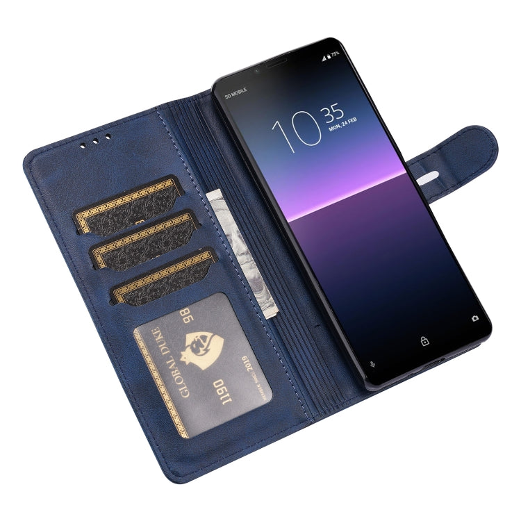 Blue leather wallet-style phone case with card slots and embossed cat emblem