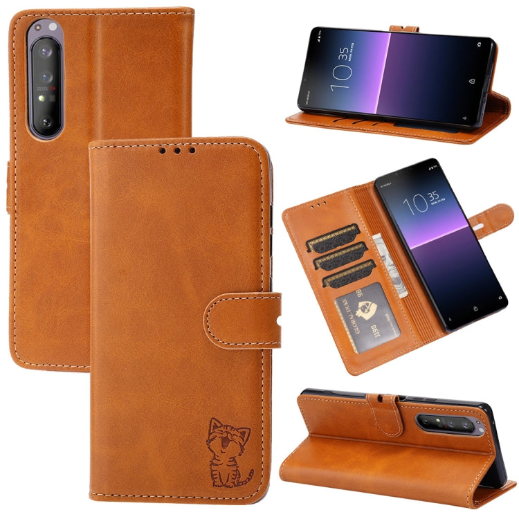 Tan leather flip phone case with embossed cat, card slots, and fold stand