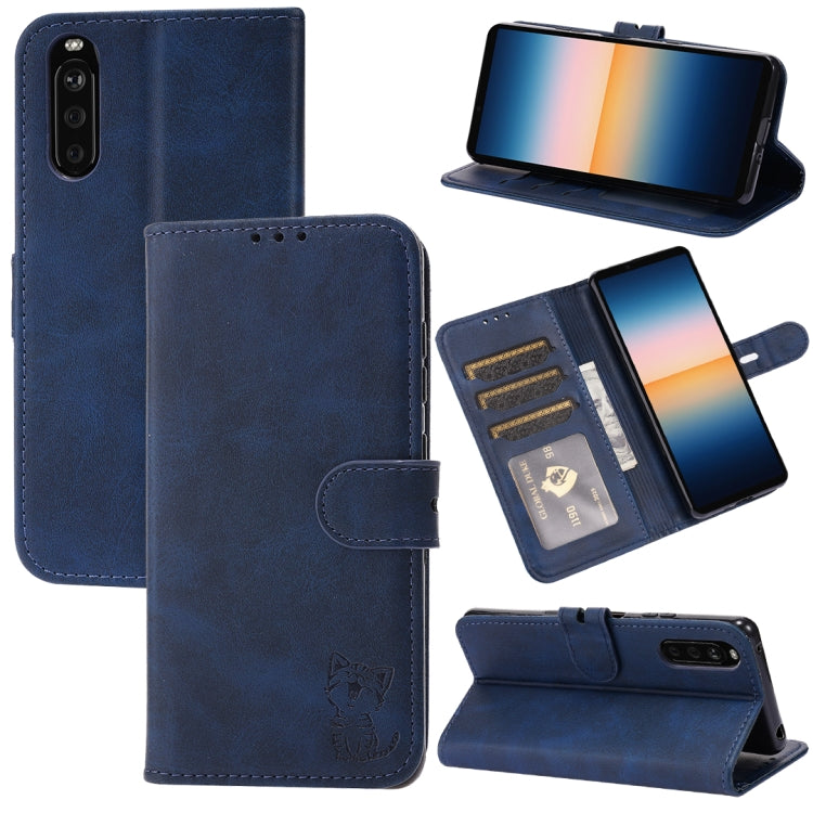 Blue leather flip phone case with embossed cat, card slots, and fold stand