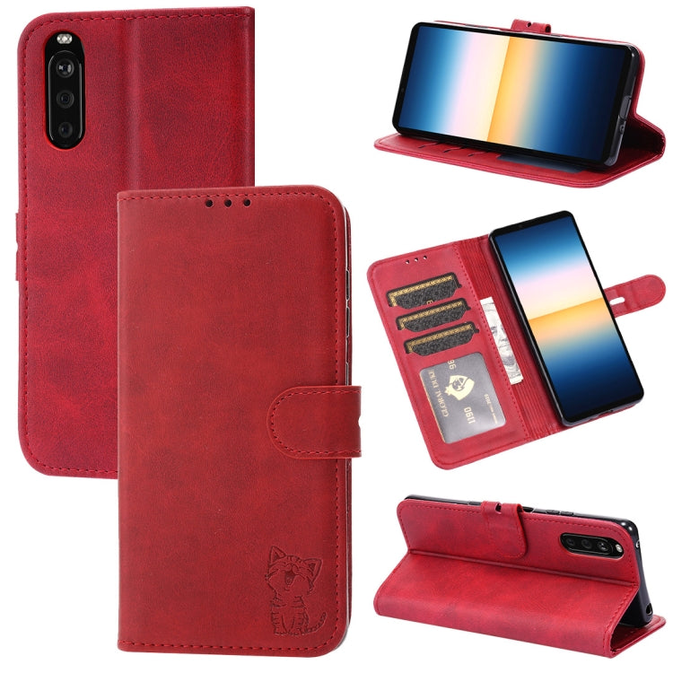Red leather flip phone case with embossed cat, card slots, and fold stand
