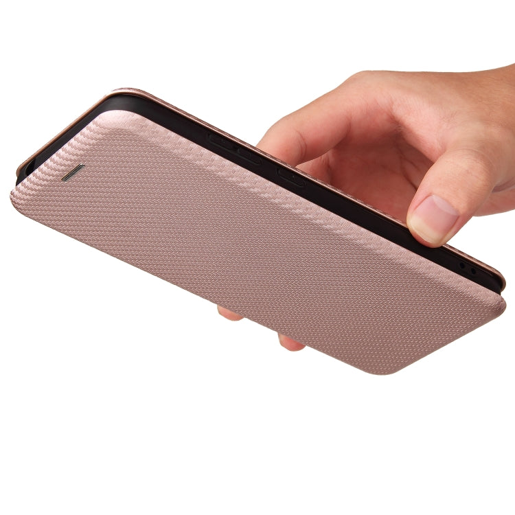 Pink carbon fiber texture magnetic flip phone case held with cover open