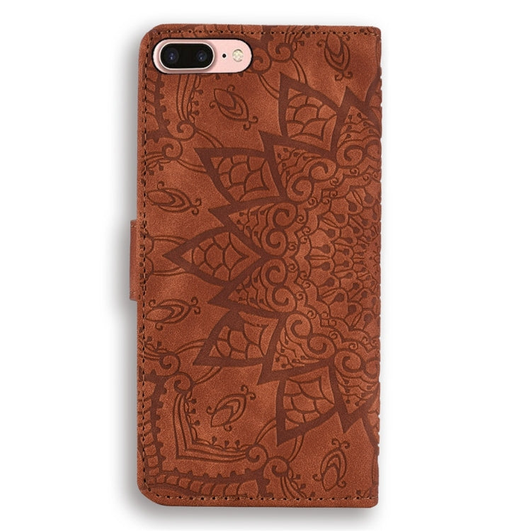 Brown embossed mandala leather phone case with stitched edges and camera cutout