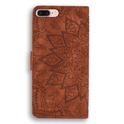 Brown embossed mandala leather phone case with stitched edges and camera cutout