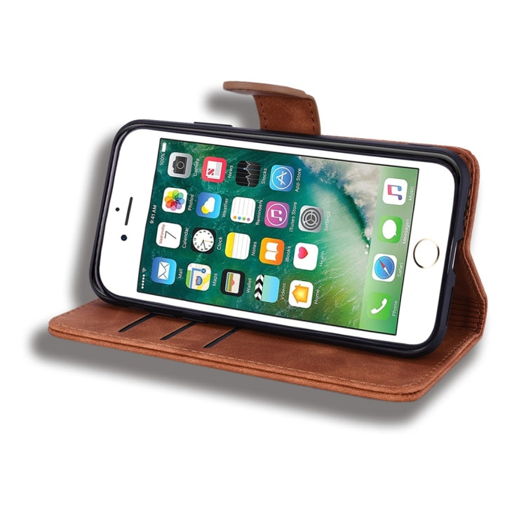 Brown leather phone wallet case with kickstand-style holder, phone screen visible