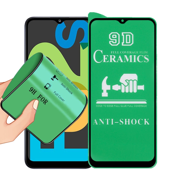 9D ceramics full-glue screen protector film with green anti-shock design, held for fitting