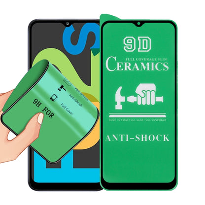 9D ceramics full-glue screen protector film with green anti-shock design, held for fitting