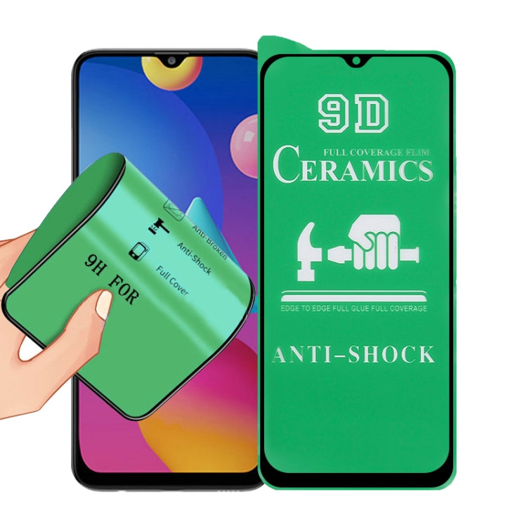 9D ceramics full-glue screen protector film with green anti-shock design, held near phone