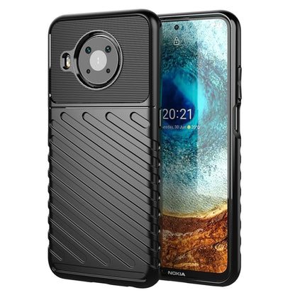 Black phone case with textured ridges and circular camera area